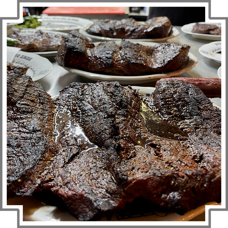 Close-up of a large steak with a blurred background