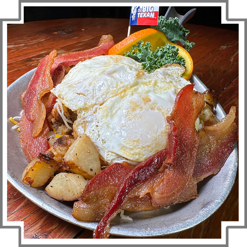 skillet of potatoes fried eggs and bacon