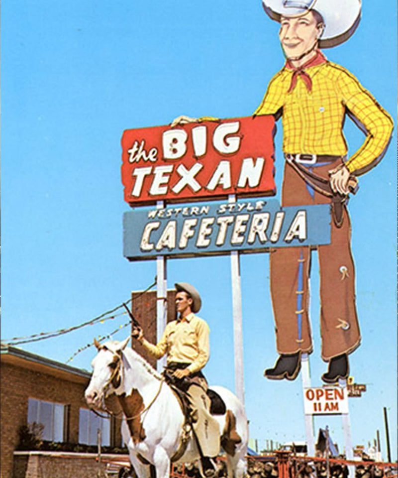 Vintage-style sign for 'The Big Texan Western Style Cafeteria' with a cowboy on horseback.