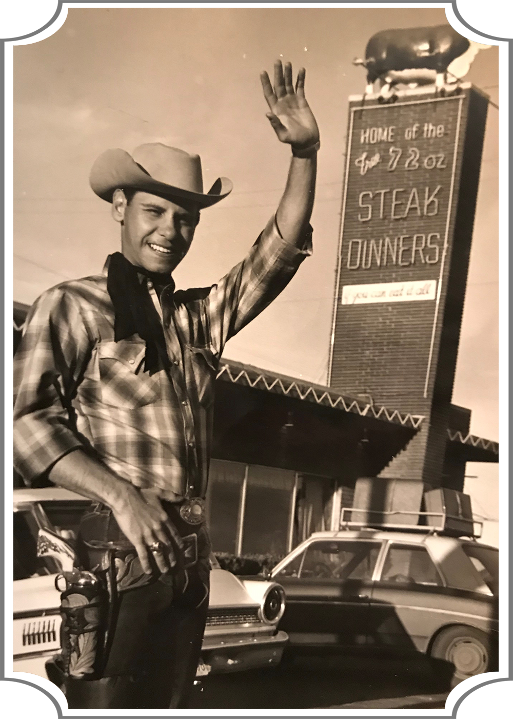 Vintage black and white photo of a cowboy waving in front of the old Big Texan.