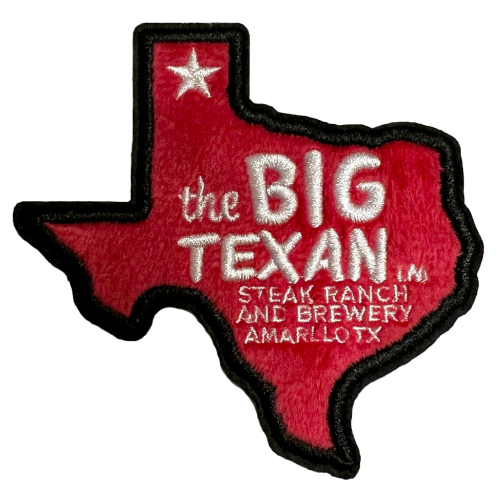 Embroidered patch of Texas shaped like a state in red with 'the Big Texan' in white text 